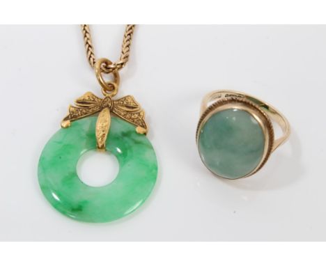 Chinese green jade pendant with gold mounts, on chain, together with a similar ring (2) CONDITION REPORT Pendant - mount is s
