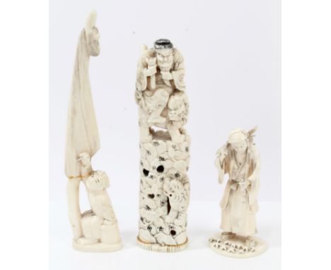 Late 19th / early 20th century Japanese carved ivory figure of a woodman, holding a pipe and carrying a bundle of sticks, on 