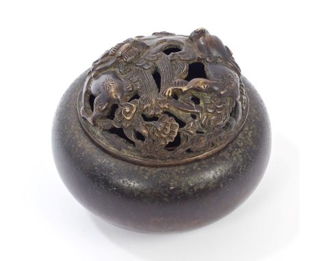 Antique Chinese bronze censor and cover of squat bulbous form, the pierced domed cover moulded with shi and flowers, the base