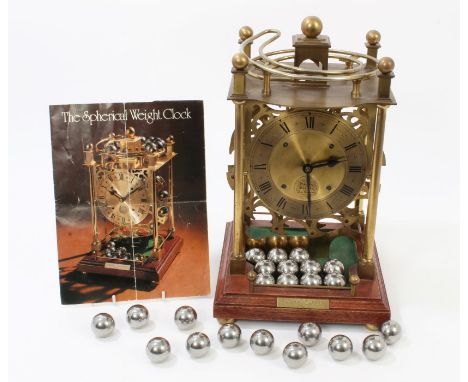 Unusual spherical weight clock, by Harding & Bazeley, Cheltenham, with brass open frame, gilt dial, on mahogany base, with ba