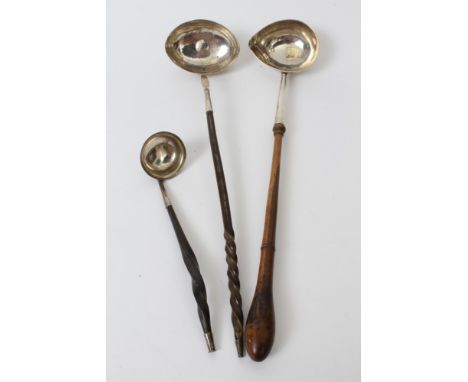 Georgian silver ladle with turned wooden handle, another toddy ladle with twisted whalebone handle and one other (various dat