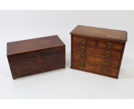 Late Regency burr yew-wood tea caddy of rectangular form, on brass bun feet, enclosing three lidded compartments, 30cm wide, 