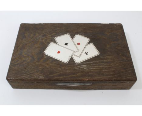 Continental vintage limed wood games compendium box, the hinged lid with inset silver and enamelled playing card design, stam