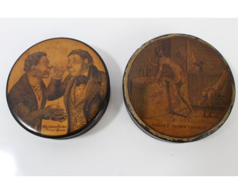 Two 19th century Continental circular papier mâché snuff boxes, the first a German box with comical engraving to cover depict