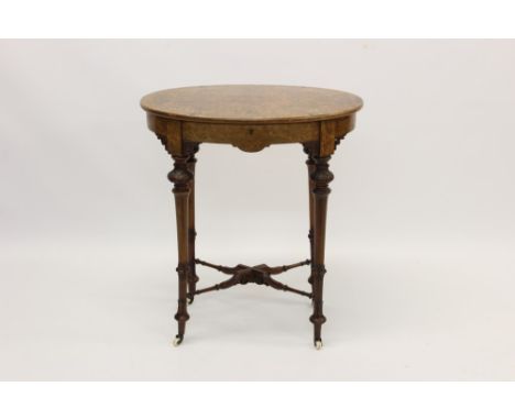 Victorian figured walnut and boxwood line-inlaid sewing table with oval hinged top, enclosing velvet-lined and fret-carved bo
