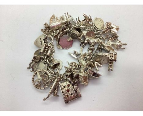 A Hallmarked Silver Chunky Curb Link Charm Bracelet, suspending assorted novelty charms including articulated, souevnir, enam