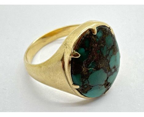 An Antique Style Mosaic Turquoise Ring, the mosaic oval panel to six claw setting, between wide tapering band (finger size N1