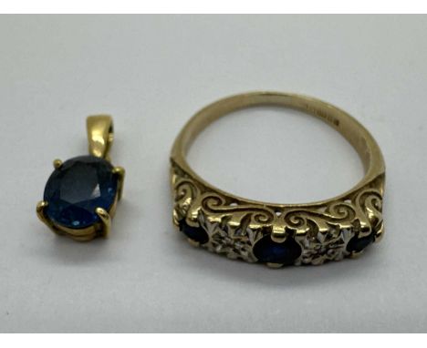 A 9ct Gold Five Stone Ring, the collet set stones within a highly decorative scroll setting, to tapered band (finger size L),