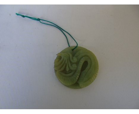 Carved jade amulet of a dragon