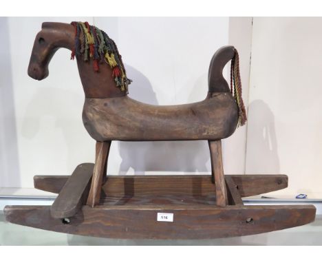 A naive Folk Art rocking horse, the hollow body serving as a money bank, the rockers measuring approx. 77cm in length Conditi