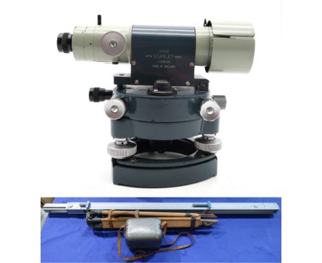 A Stanley surveyor's sight/theodolite, no. 60612, housed in a metal protective case, with substantial beech tripod and 4.5m s