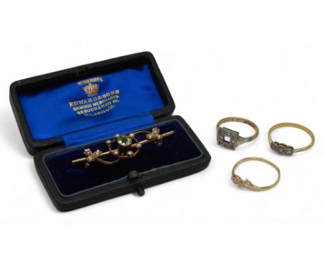 A 9ct gold vintage brooch set with peridot and pearls in its original box, a 9ct gold and platinum ring set with clear gems a