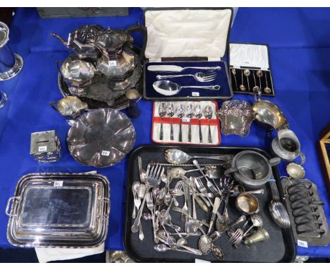 A collection of EPNS including a four piece tea service, salvers, an entree dish, a money box, loose cutlery, pewter toast ra