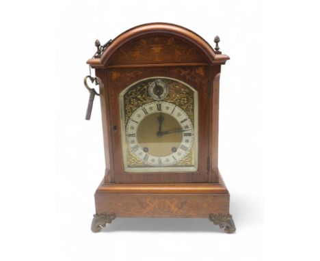 A Lenzkirch mantel clock, the inlaid case with griffins and foliage, the ormolu dial with roman numerals on a silvered chapte