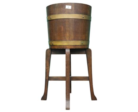 An early 20th century oak R A Lister Co Ltd coopered planter on stand, 75cm high x 37cm diameter Condition Report:Available u