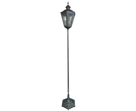 A 20th century metallic standard lamp in the form of a 19th century street lantern, 180cm high&nbsp; Condition Report:Availab