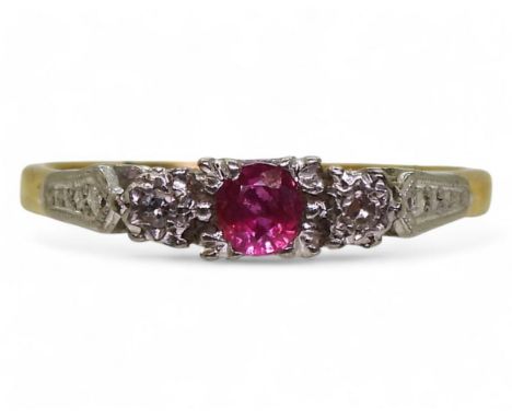 An 18ct gold and platinum vintage ring set&nbsp; with a ruby and two diamonds, in illusion star settings, size P, weight 2.3g