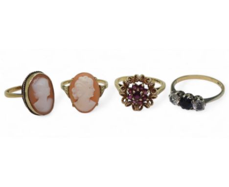 Three 9ct gold rings, two cameos sizes N &amp; O, and a ruby cluster size Q1/2, together with a 9ct and silver gem set ring, 