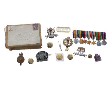 Group of seven WWI miniature service medals (with box); two '16th Queen Lancers' cap badges, Army Catering Corps badge, ATS b