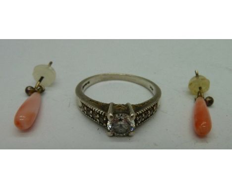 A silver and cubic zirconia ring and a pair of coral drop earrings