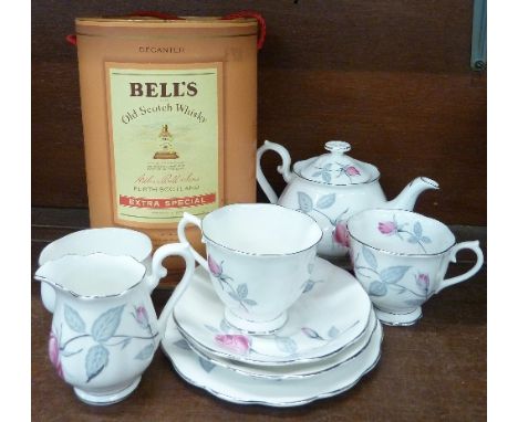 A Bell's Scotch Whisky decanter, sealed with contents and Royal Albert teaware