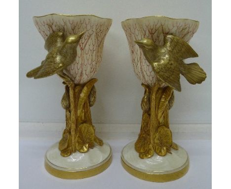 A pair of Royal Worcester Art Nouveau  two-tone gilded goblets, decorated with water lilies and bird decoration, height 19.5c