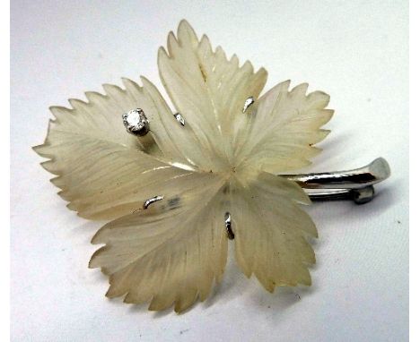 A 14k white gold and rock crystal diamond brooch (tip of leaf a/f)