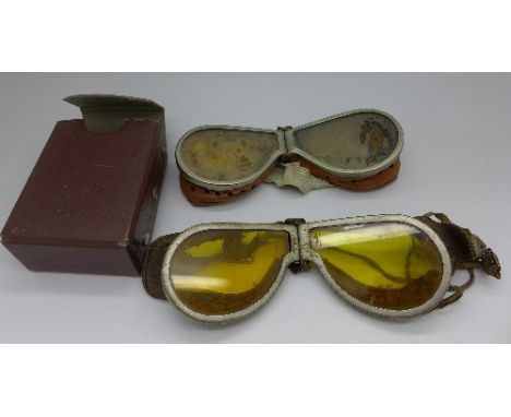 Two pairs of goggles, one with box and yellow lens