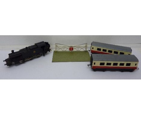 A Palitoy 66110 0 gauge engine and two carriages