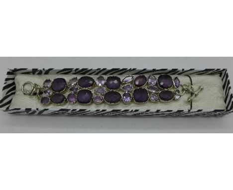 A silver and amethyst bracelet