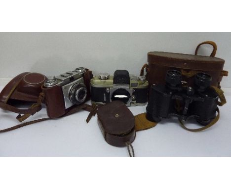 A Zeiss Ikon Contina camera, an Alpa Alnea film camera body, a Weston Master III light meter and a pair of binoculars