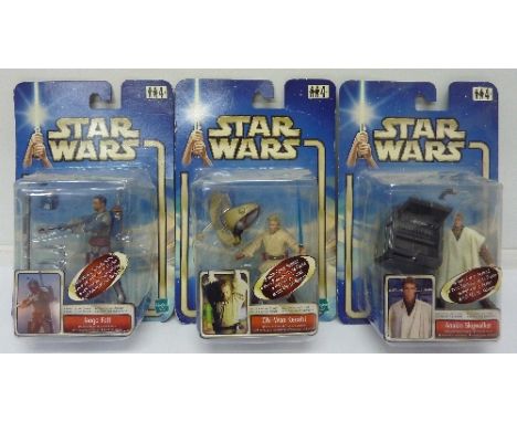 Three Star Wars figures in bubble packs, Jango Fett, Anakin Skywalker and Obi-Wan Kenobi