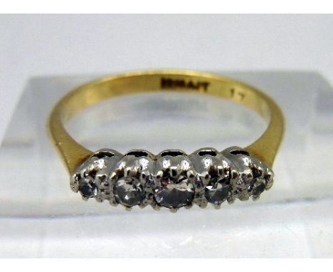 An 18ct gold and platinum set five stone diamond ring, weight 2.5g, size M