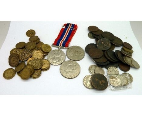 A collection of 18th and 19th Century tokens including an 1812 British Naval halfpenny, a Birmingham Mining and Copper Compan