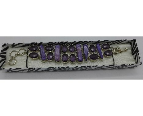 A silver and amethyst bracelet