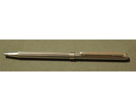 Christian Dior, a silver ball point pen with ribbed body