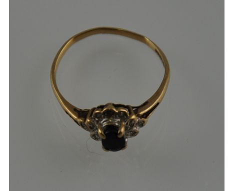 A vintage 9ct gold, black sapphire and diamond ring