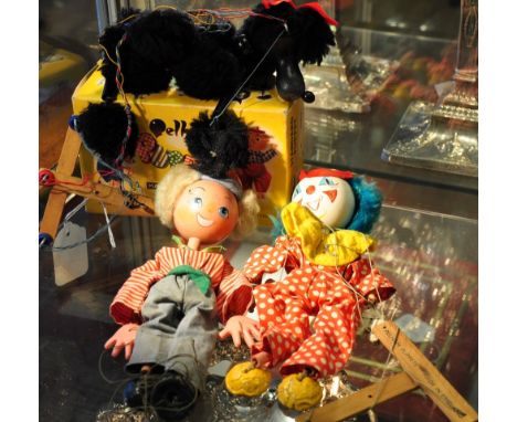 A boxed Pelham puppet, A4 poodle together with two unboxed Pelham puppets, clown and boy