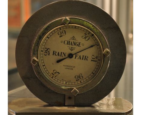 A 1950s chrome and silvered bakelite desk barometer retailed by Harrods London, h:9cm