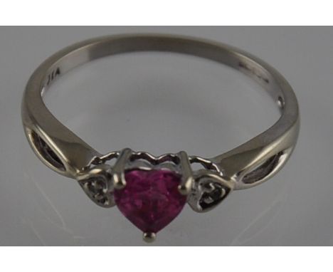 A 9ct white gold pink sapphire and diamond ring