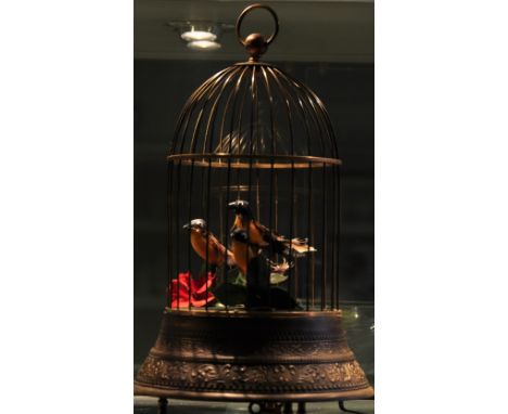 A Victorian style bronzed metal singing bird automaton, h:30cm