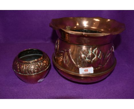 An arts and crafts copper planter with embossed design and smaller pot with similar design, both are unmarked.
small platter 