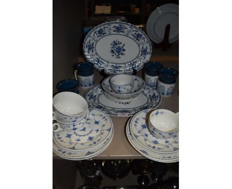 A mixed collection of blue and white china including Danish cups and saucers,large Johnson brothers plates and more, around t