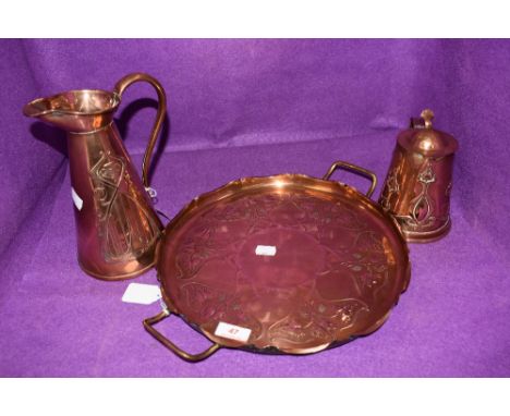An arts and crafts copper tray with brass feet and handles to either side,jug(J.S&amp;S.B to underside) and hot water jug(J.S