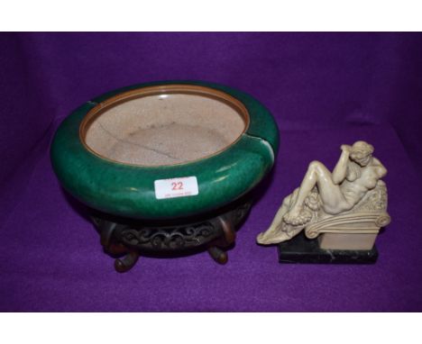 A very heavy set Chinese hard paste bowl having Guan type glaze over Jade green ground having been broken in two and re fired