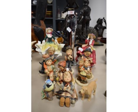 A collection of Goebel figurines, two Royal Doulton figurines and more.
&nbsp;UNMARKED LABRADOR HAS SMALL CHIP
Slight nibble 