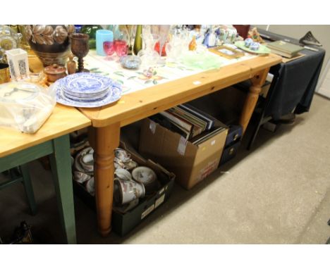 A pine and tile top kitchen table 