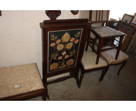 A Victorian mahogany embroidered fire screen