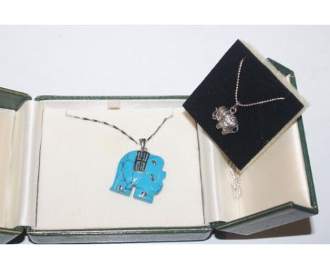 A silver and turquoise elephant pendant on chain and another 