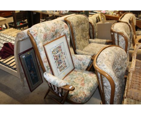 An Ercol three piece suite comprising of a two seater settee and two matching armchairs